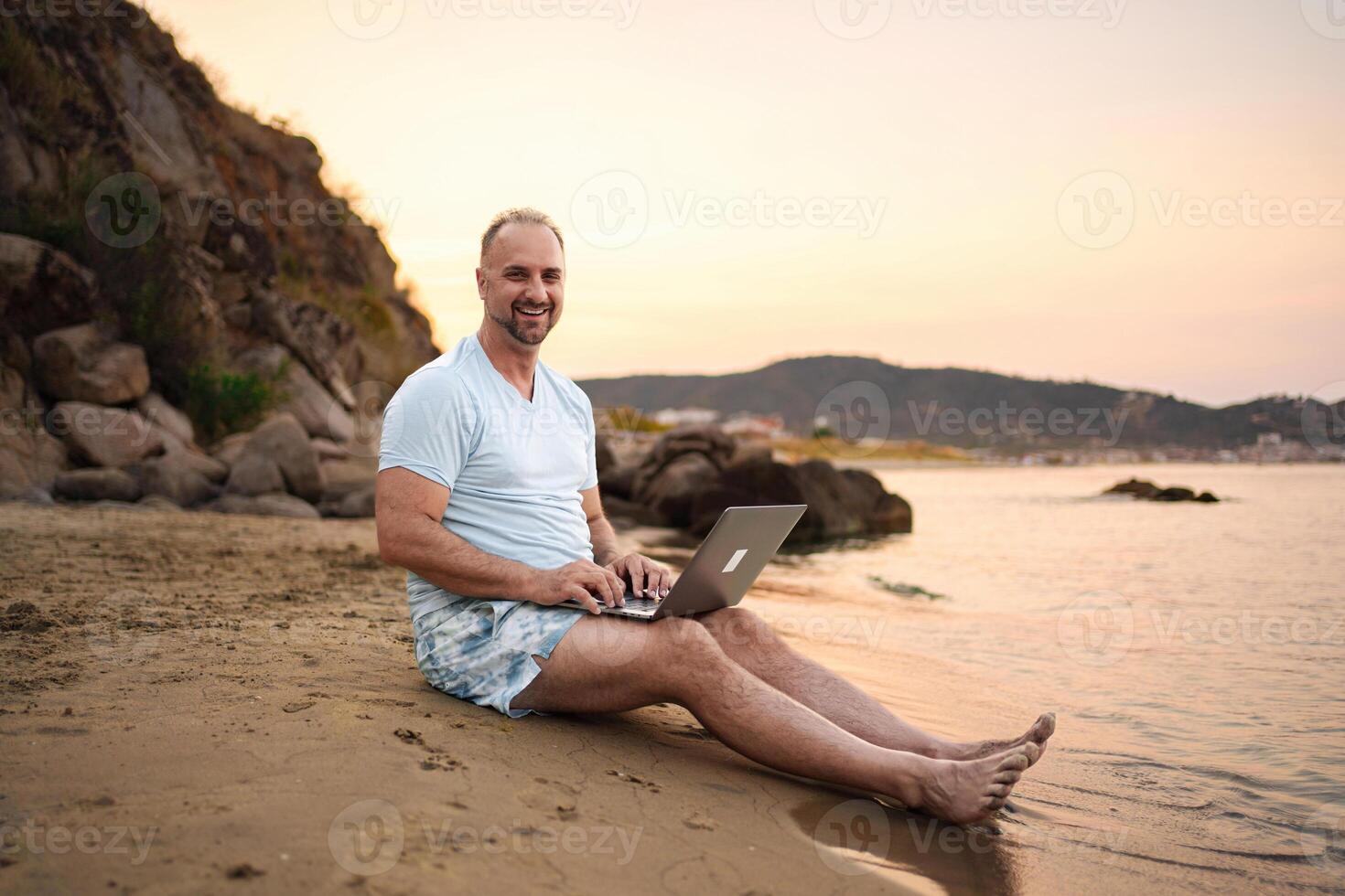 Family enjoying a peaceful day at the beach during sunset photo