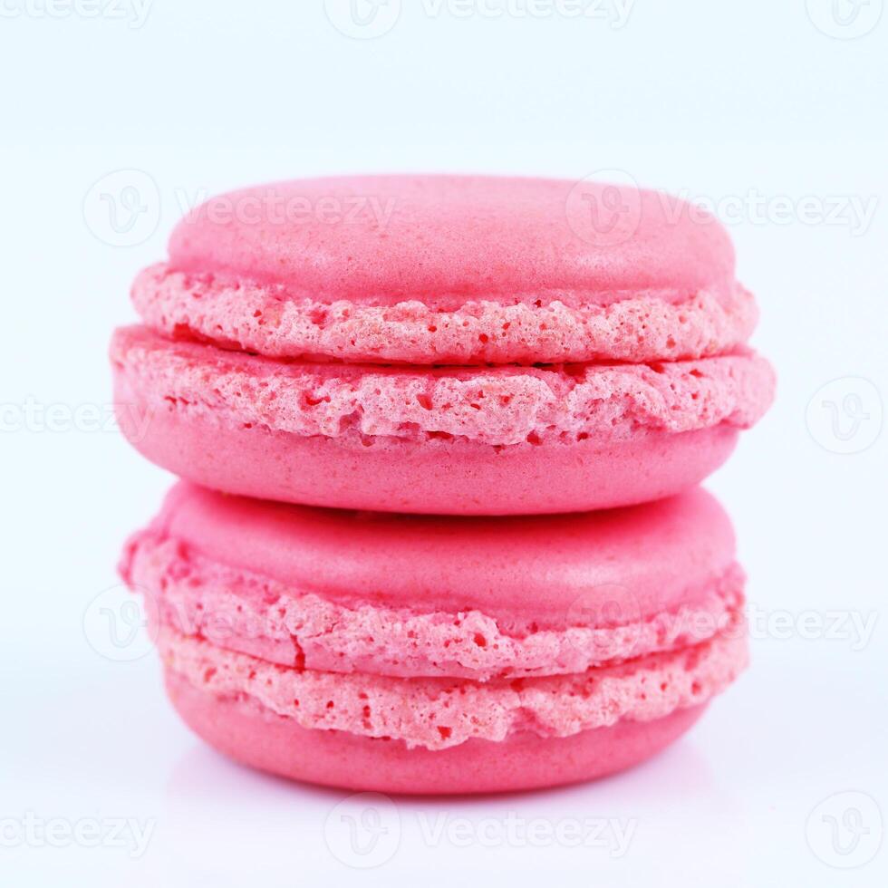 two colorful pink macaroons isolated on white photo