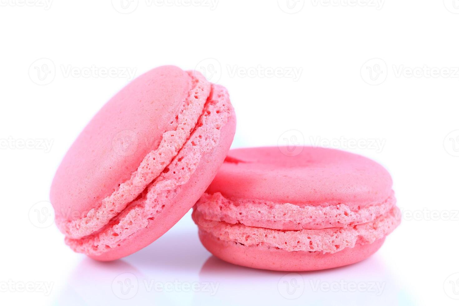 pink macaroons isolated on white photo
