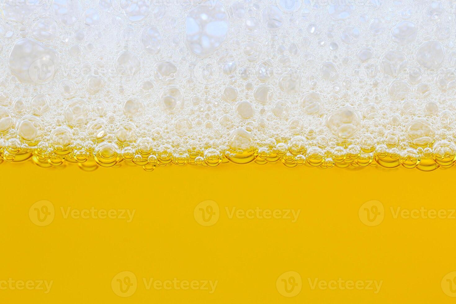 Foam and yellow beer for pattern photo