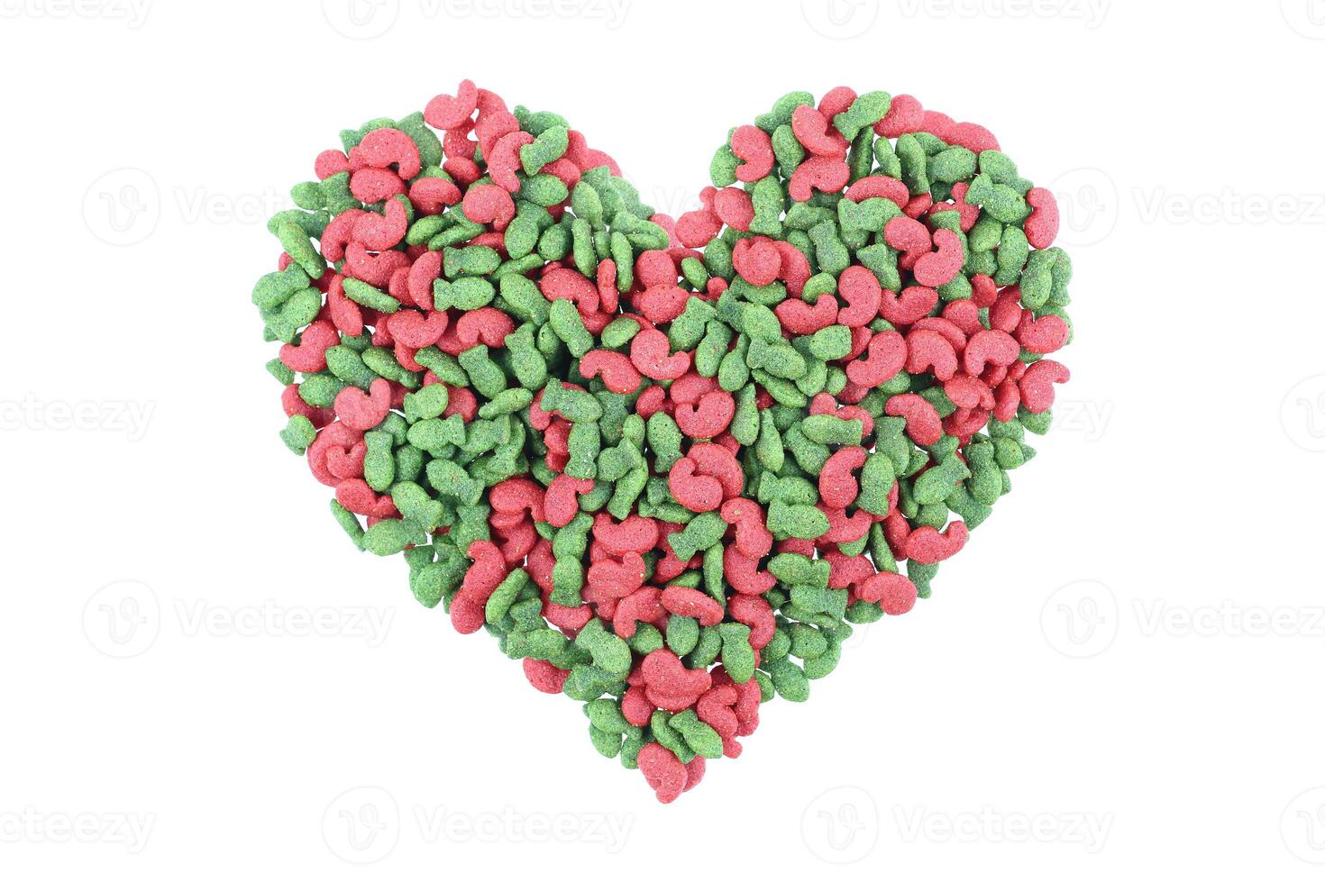 heart shaped pets food isolated on white photo
