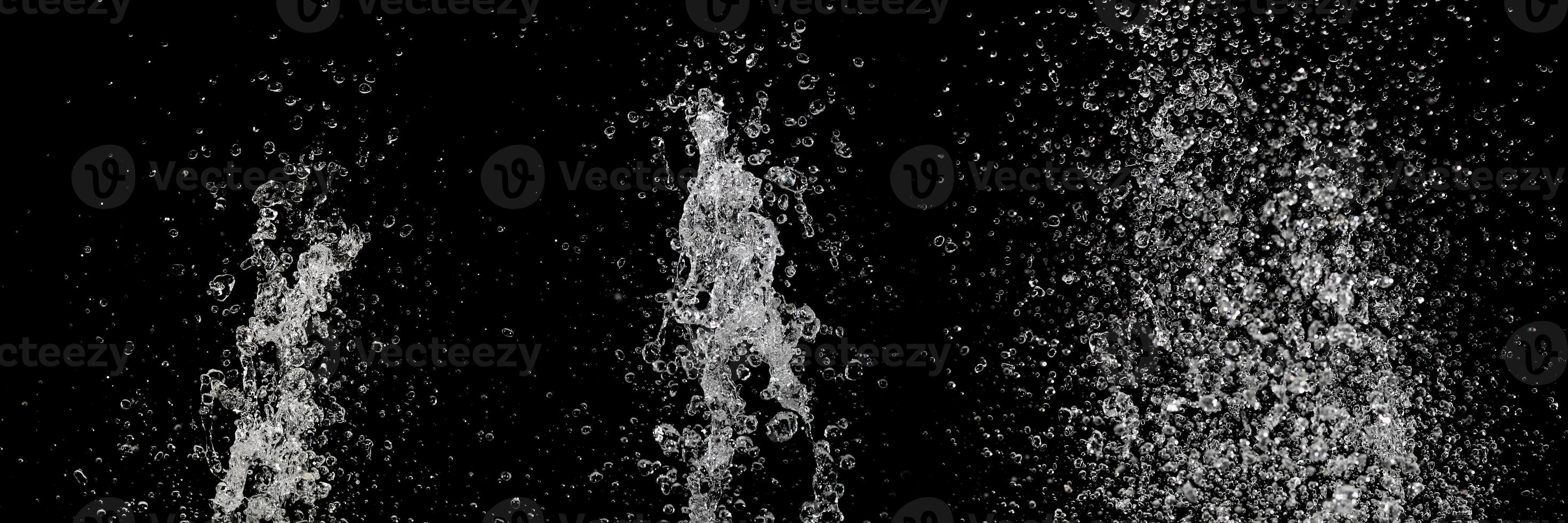 clear water splash isolated on black photo