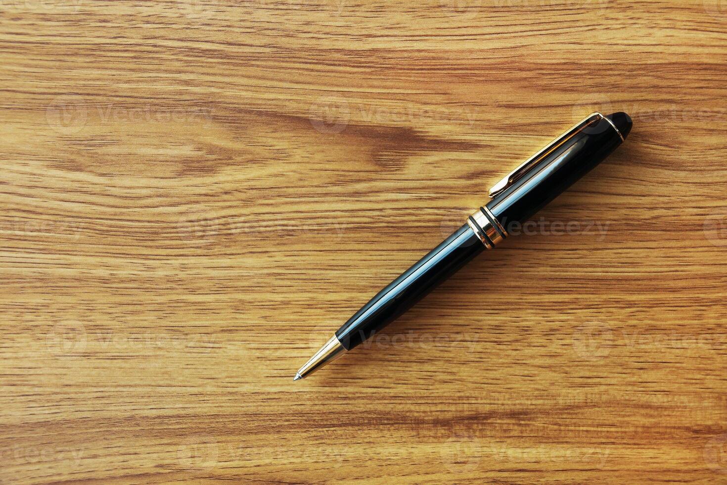 one black business pen on wood background photo