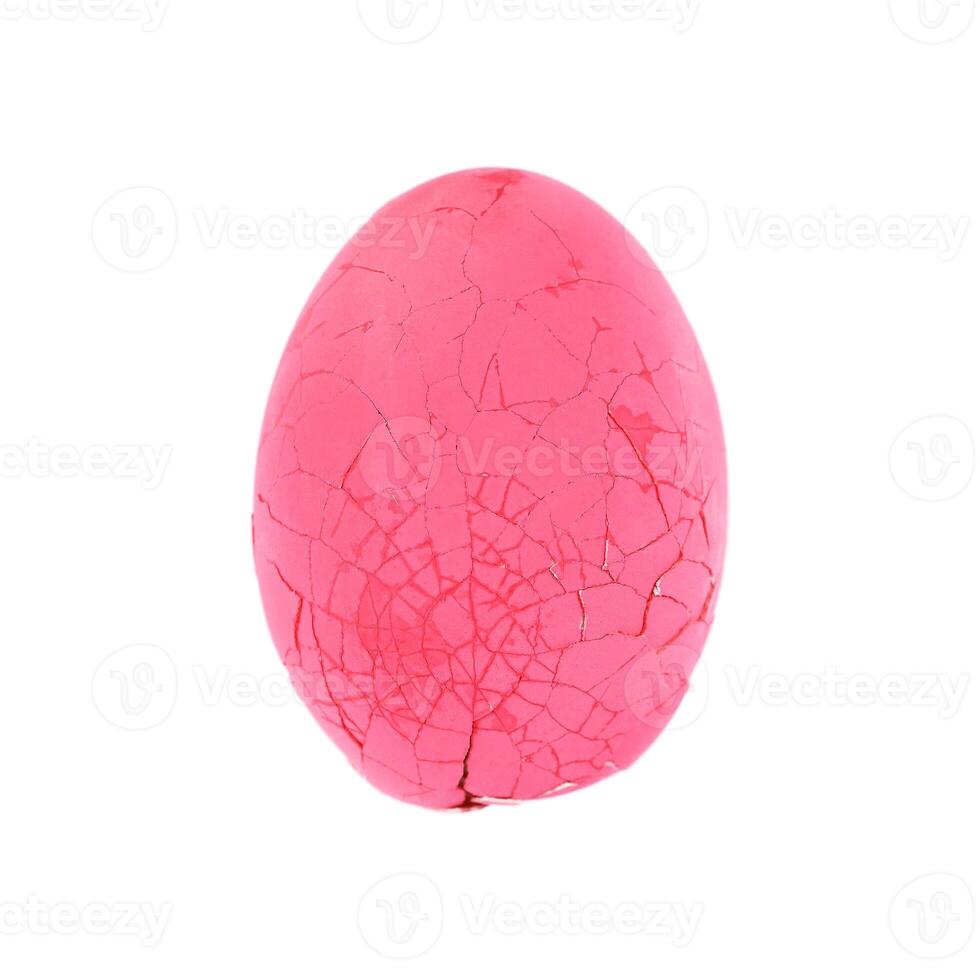 one broken preserved egg isolated on white photo