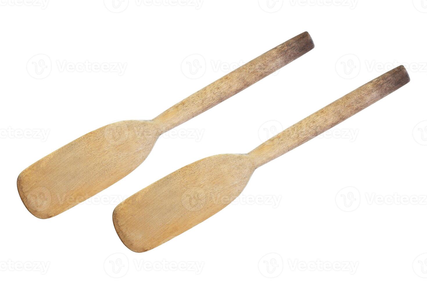two old cooking wood paddles isolated on white photo