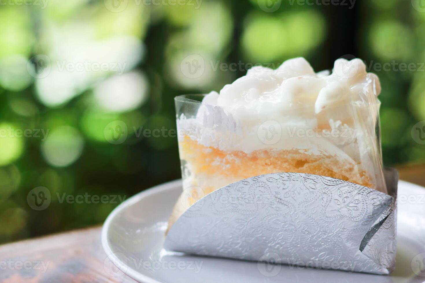 coconut cake on table with green boken blur background photo