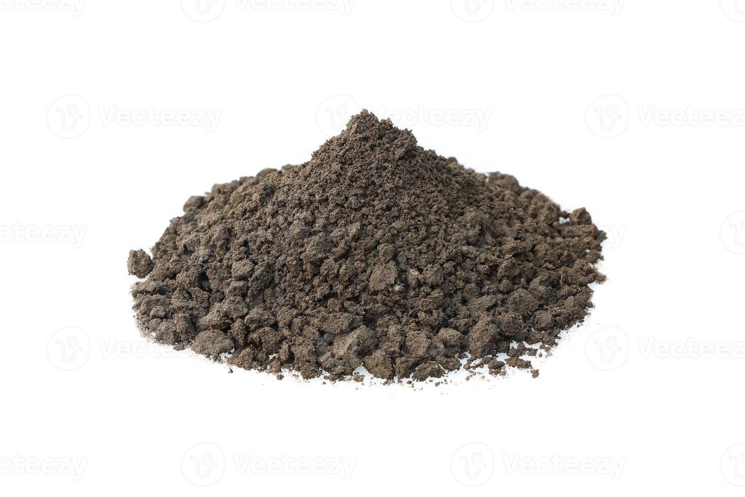 pile of mixed fertilizer and soil isolated on white. photo