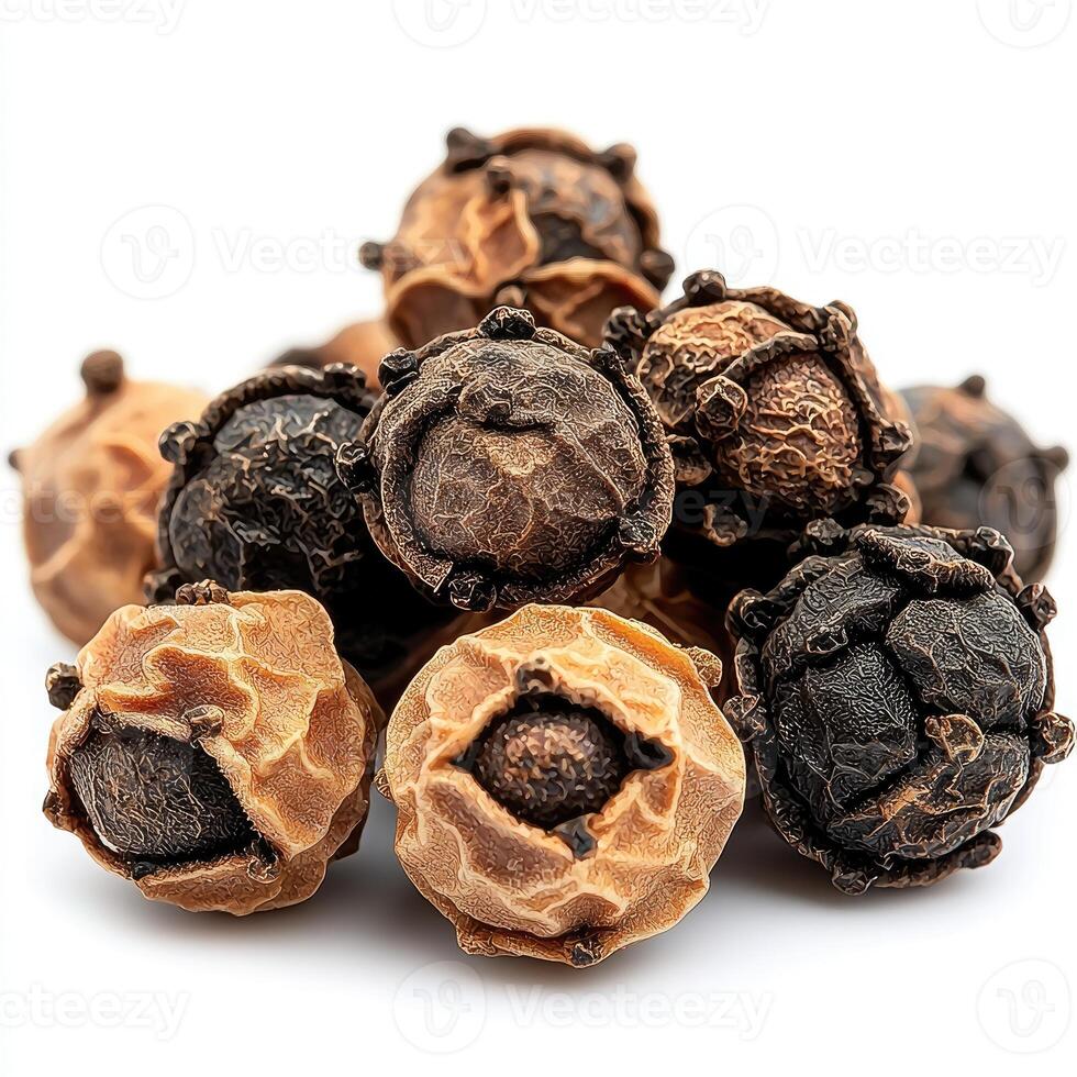 Close-up view of assorted dried, small, textured seeds. photo