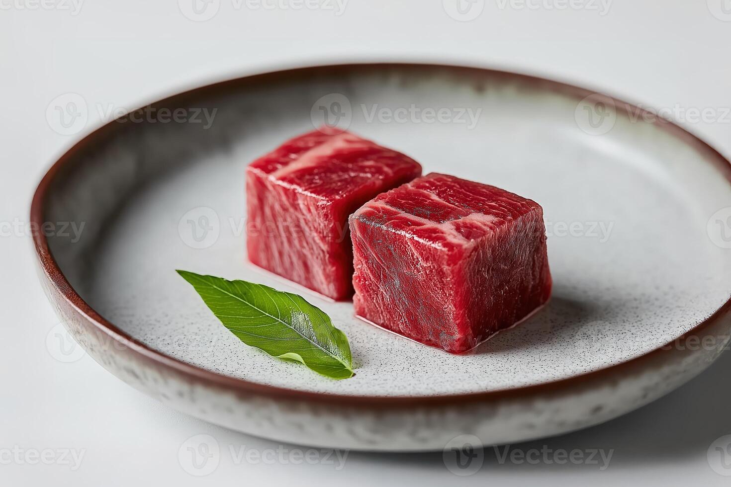 Two exquisite wagyu cubes prepared for a michelin star experience photo