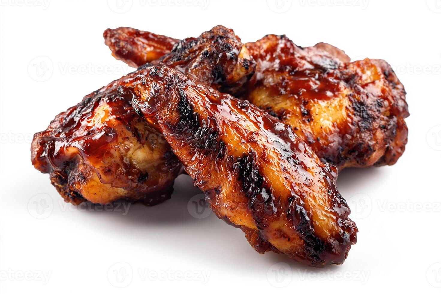 Tender grilled chicken wings glazed with sweet BBQ sauce arranged on white plate photo
