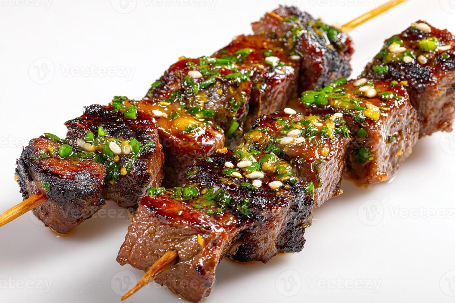 Close up of grilled garlic beef kababs on white background with simple presentation photo