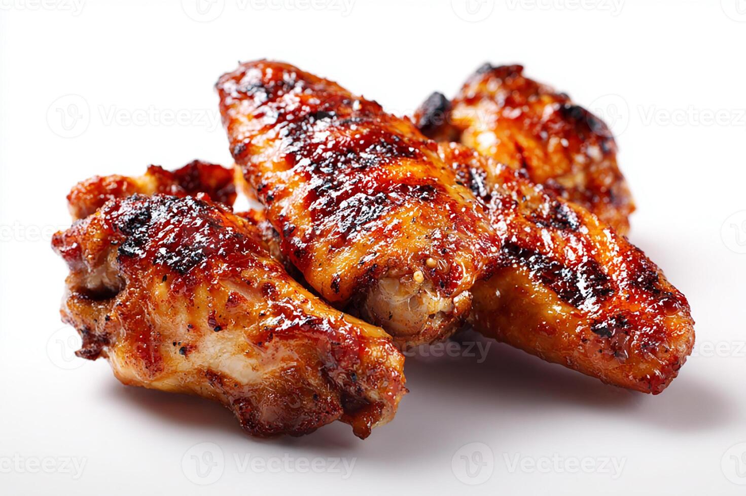 Realistic grilled chicken wings coated with sticky BBQ glaze on white background photo