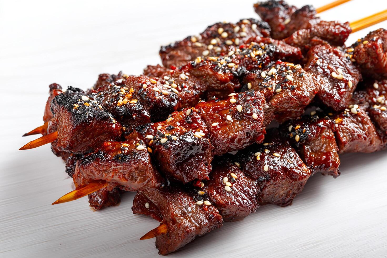 Delicious garlic marinated beef kababs grilled to perfection with charred edges photo