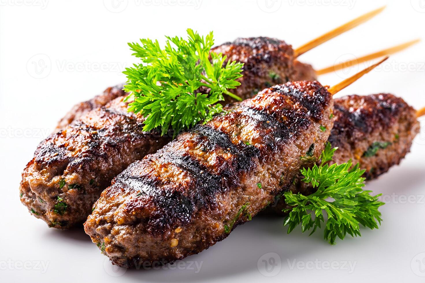 Delicious grilled minced beef kofta kababs with smoky char marks on white surface photo