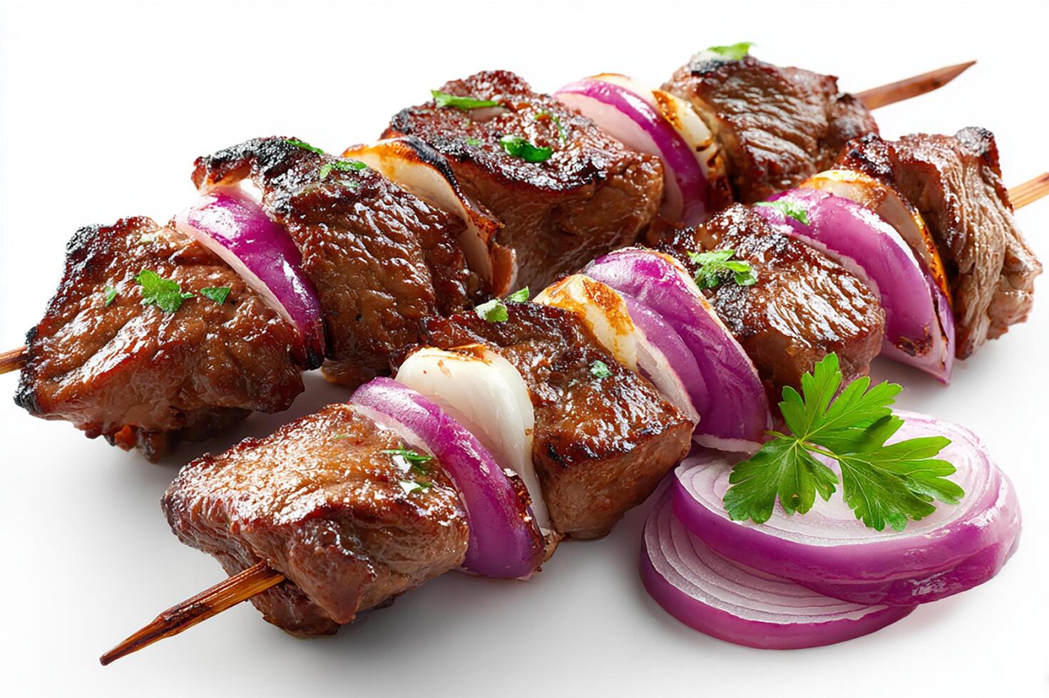 Tasty grilled beef kababs featuring sliced onions and garlic for rich flavor photo