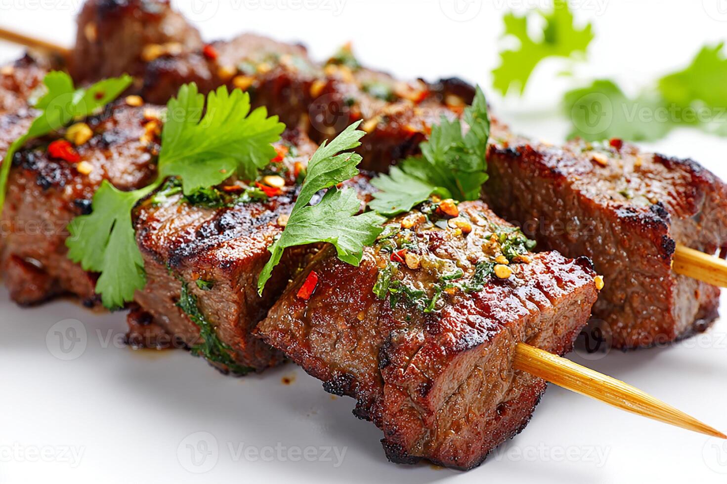 Realistic grilled beef skewers with coriander leaves on white background photo
