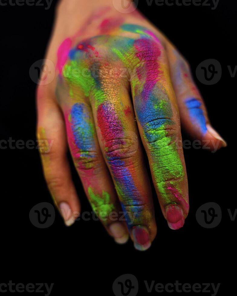 A Portrait of an Artist's Hand full of paint photo
