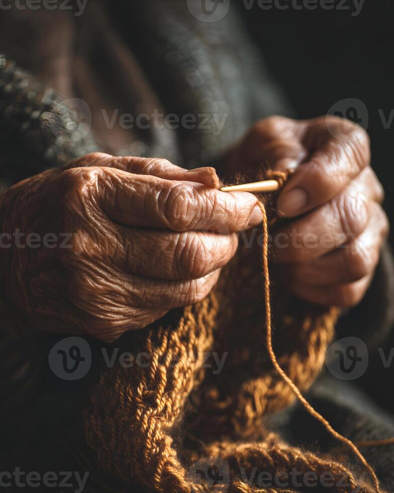 Elderly Hands Knitting Warm Brown Wool Yarn in Closeup with Soft Lighting photo