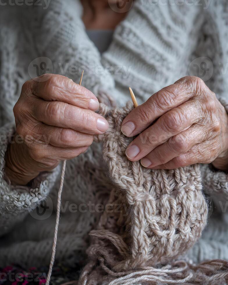 Elderly Woman Knitting Warm Beige Wool Sweater with Wooden Needles in Cozy Indoor Setting photo