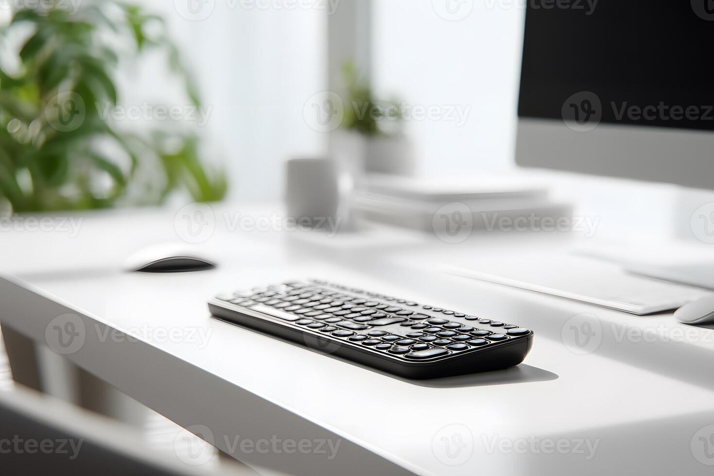 Minimalist White Office Desk with Wireless Keyboard and Computer Monitor in Bright Natural Light photo
