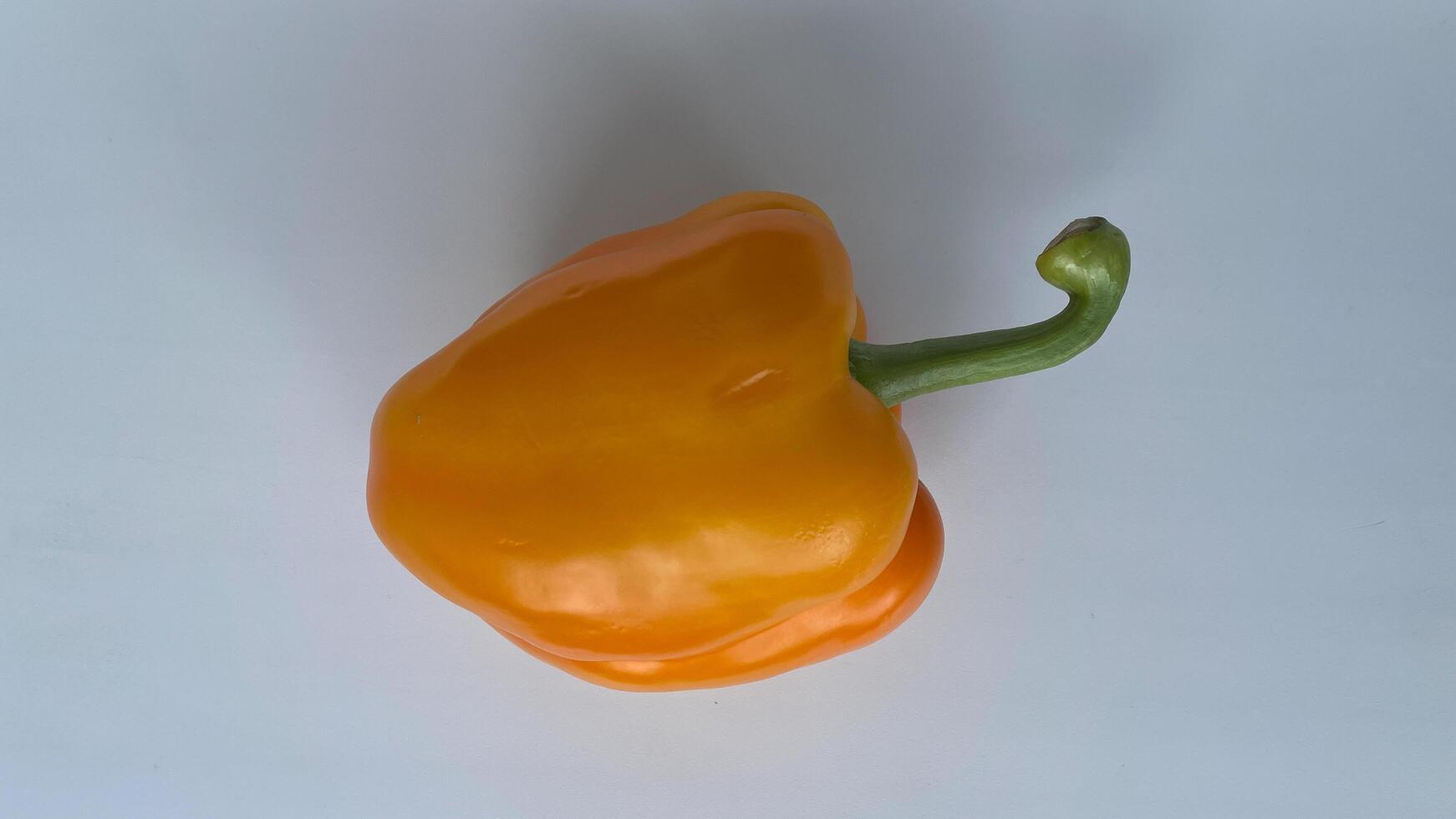 Fresh organic yellow bell pepper create a healthy, colorful composition perfect for food blogs, healthy eating concepts, or vegetarian recipes. Ideal for promoting farm produce, vegan lifestyle, and clean eating visuals photo