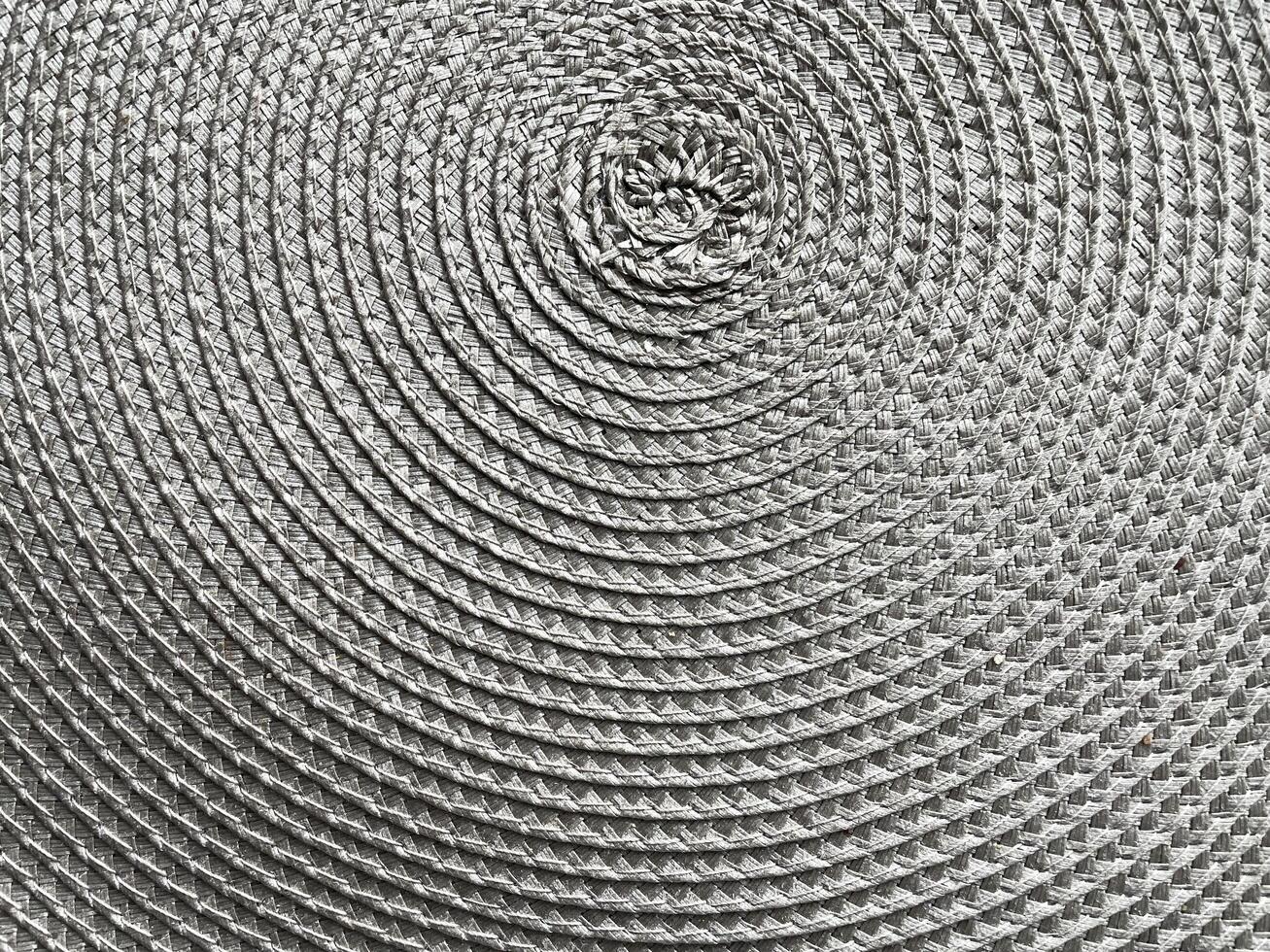 A close up of a circular pattern on a white surface photo