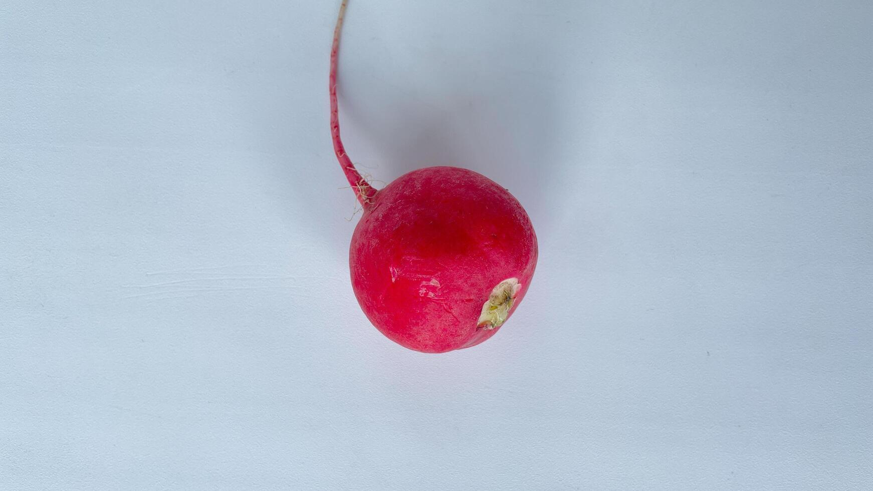 Fresh organic red radish on a light background create a healthy, colorful composition perfect for food blogs, healthy eating concepts, or vegetarian recipes. Ideal for promoting farm produce, vegan lifestyle, and clean eating visuals photo