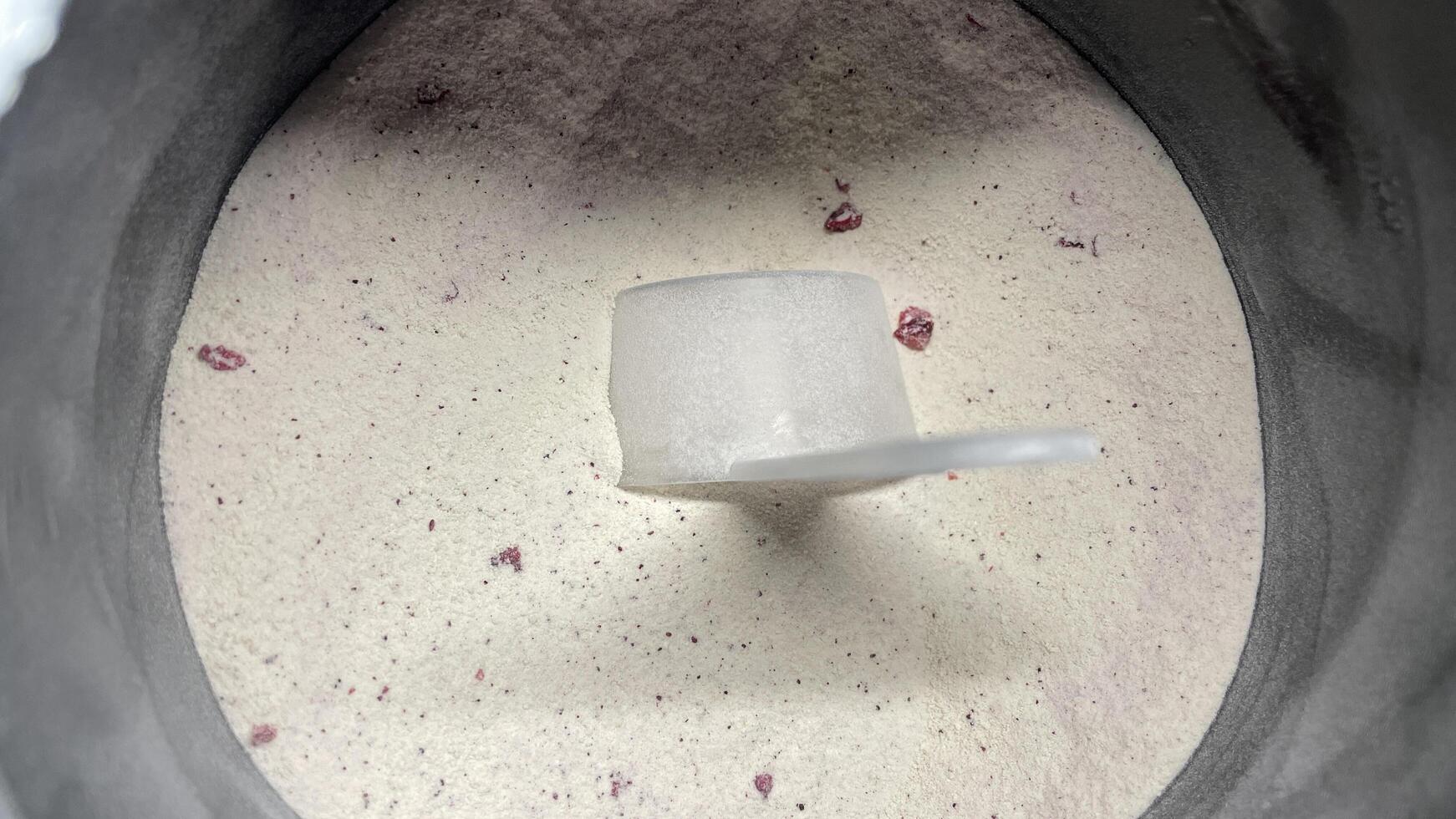 A white substance in a mixer with a red object photo