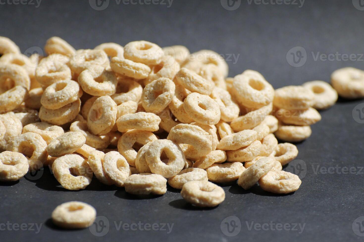 Corn Flakes Rings in the black Background photo