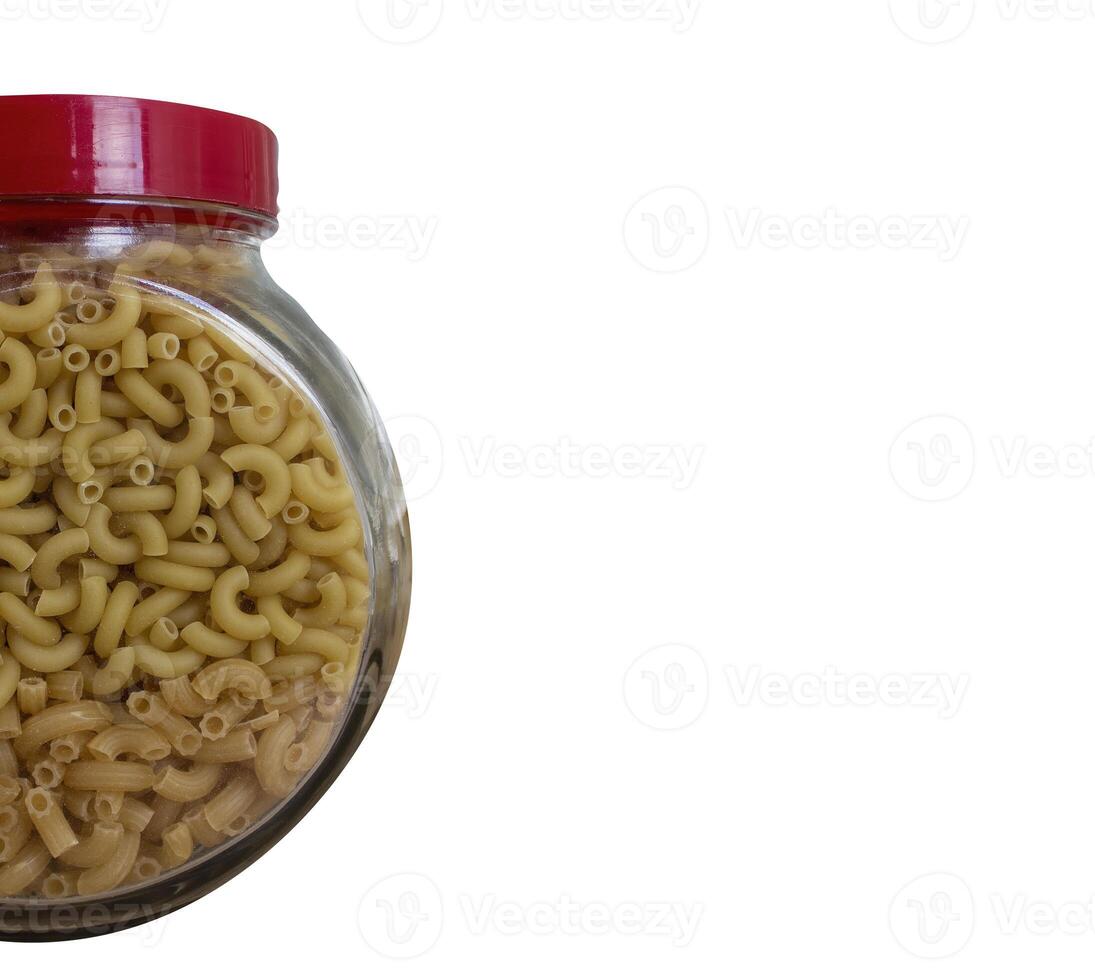 Pasta in a glass jar. Jar with pasta isolated on white background. High quality photo. Copy space for text photo