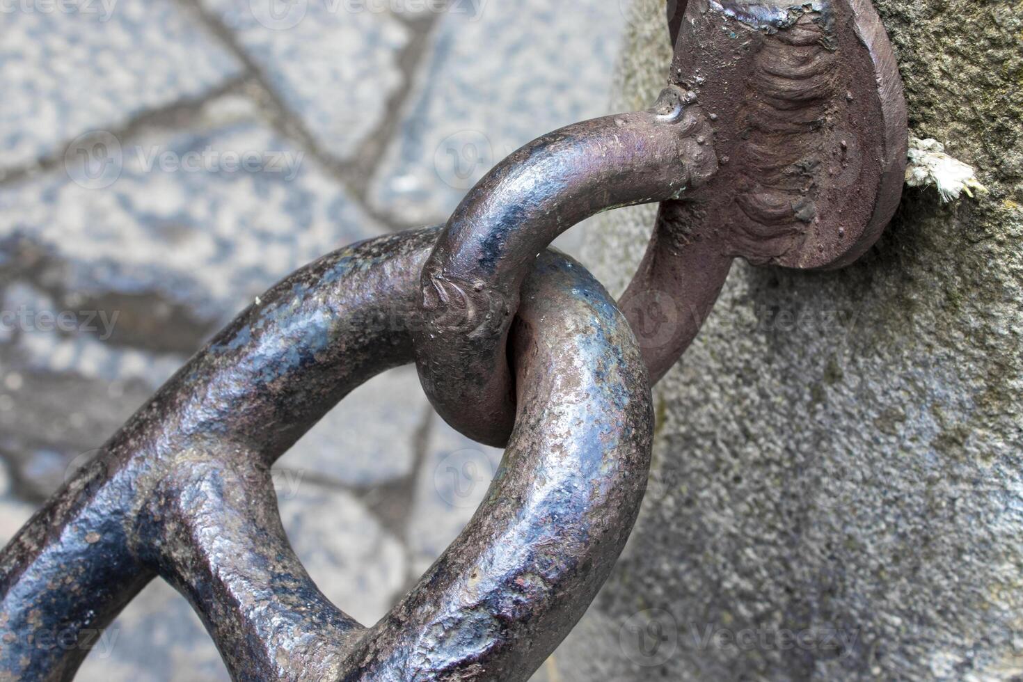 Close-up of an Old Rusty Chain Isolated on a White Background. photo