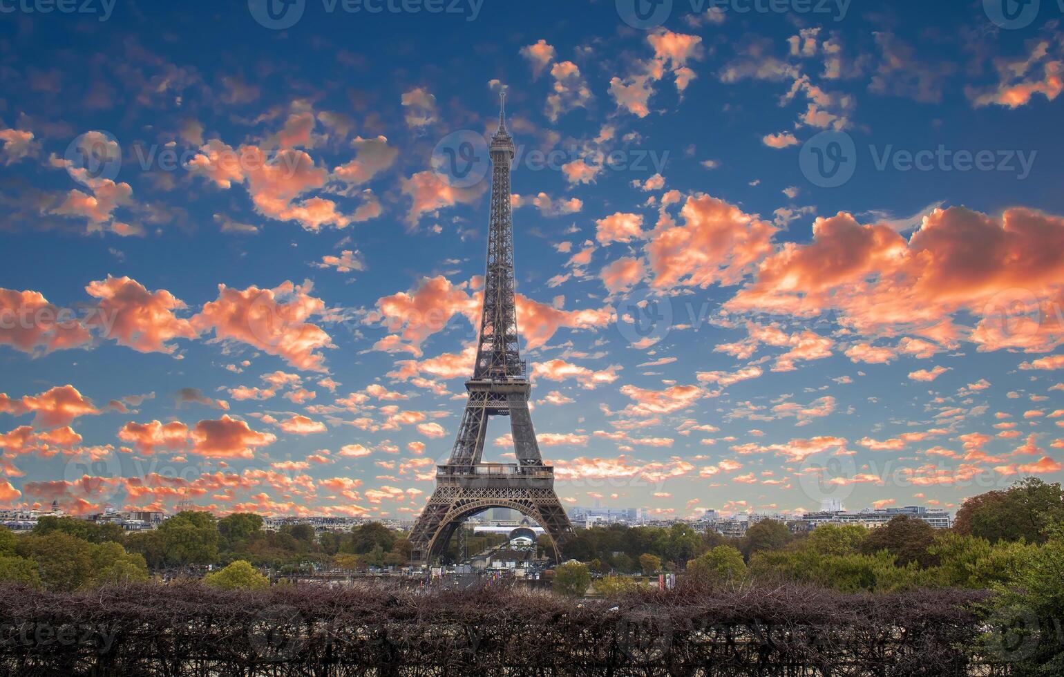 Eiffel Tower at Sunset in Paris, France. Romantic Travel Background. Amazing Panorama of Paris with Eiffel Tower Included photo
