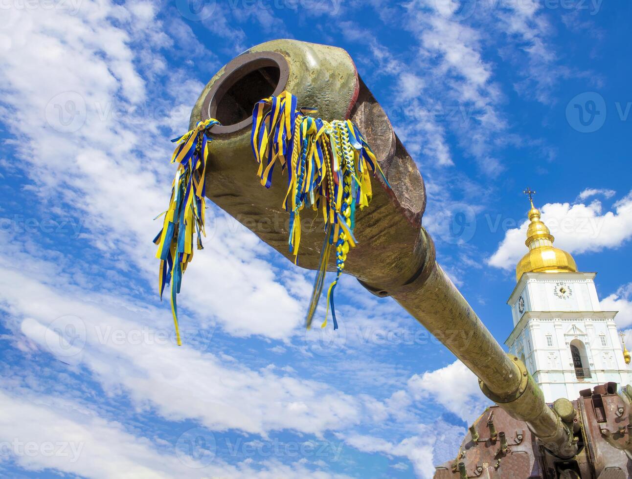The muzzle of a tank against the blue sky. Armament and military equipment photo
