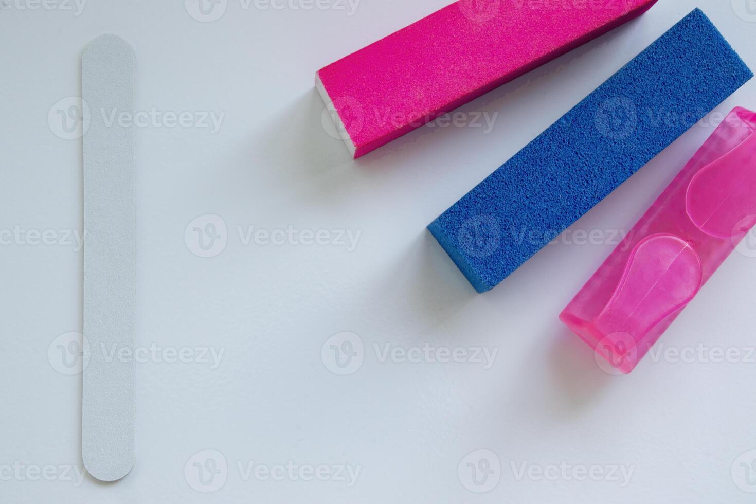 Close-up of Items for Polishing Nails, a Nail File, Buffs and a Brush. I do a Manicure with a Nail File. Hand Care at Home photo