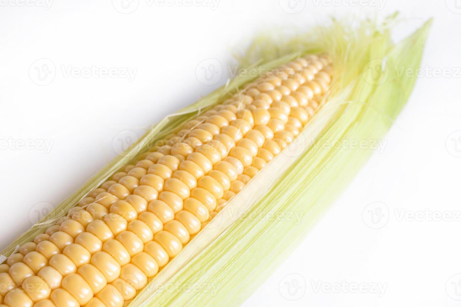 Fresh Corn Cob. Corn Ears With Leaves on White Background photo