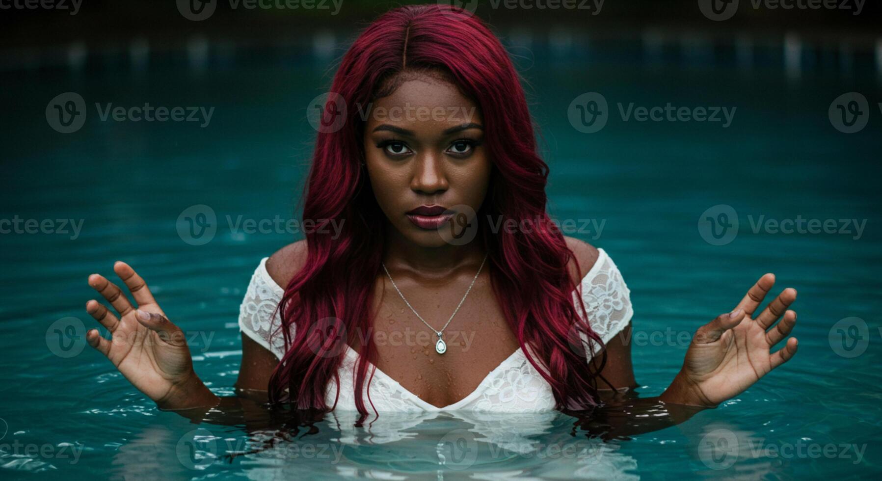 A young woman relaxes in a swimming pool, enjoying the refreshing water and serene atmosphere. photo