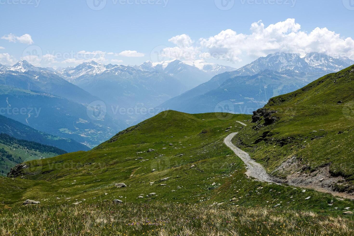 View of a path and the mountains of the Haute Tarentaise at an altitude of over 2000 meters in the Alps in Savoie photo