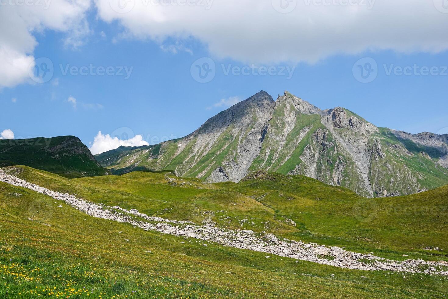 View of a plateau and mountain range high in the Alps at Bourg-Saint-Maurice photo