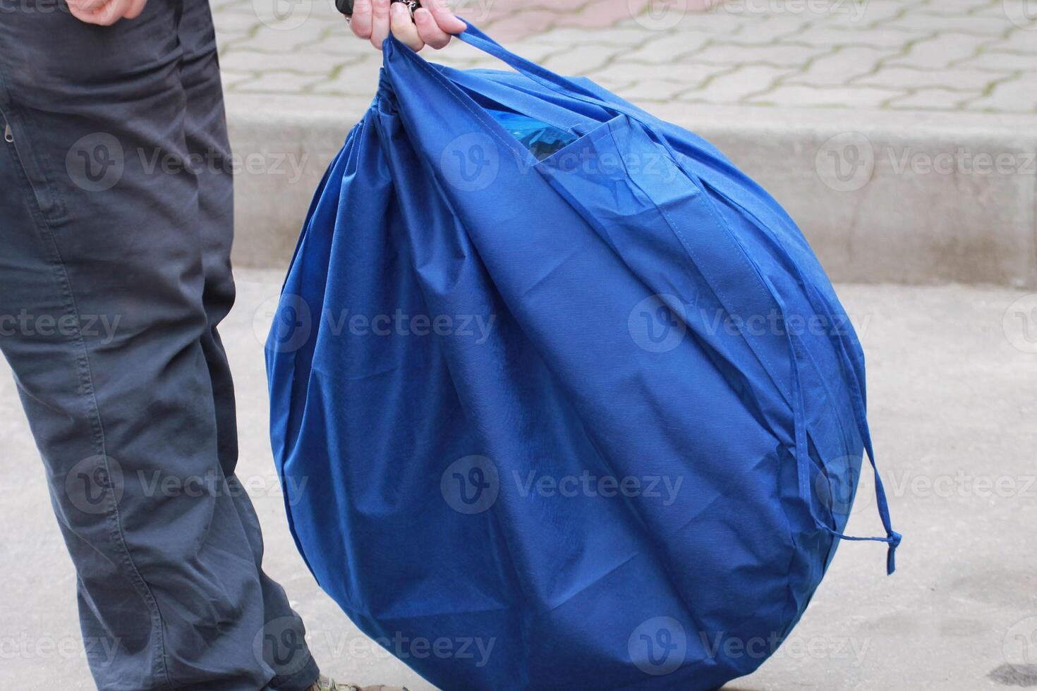 Blue fabric bag for storing tires. Spare Wheel Cover photo