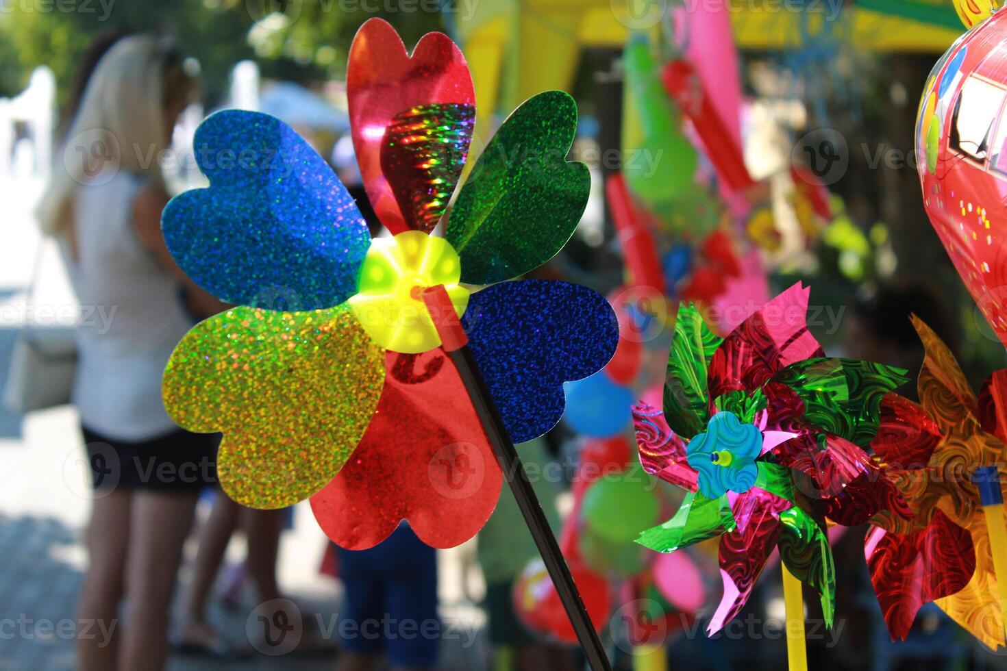 Paper windmill for children in a Sumy city park of Ukraine photo