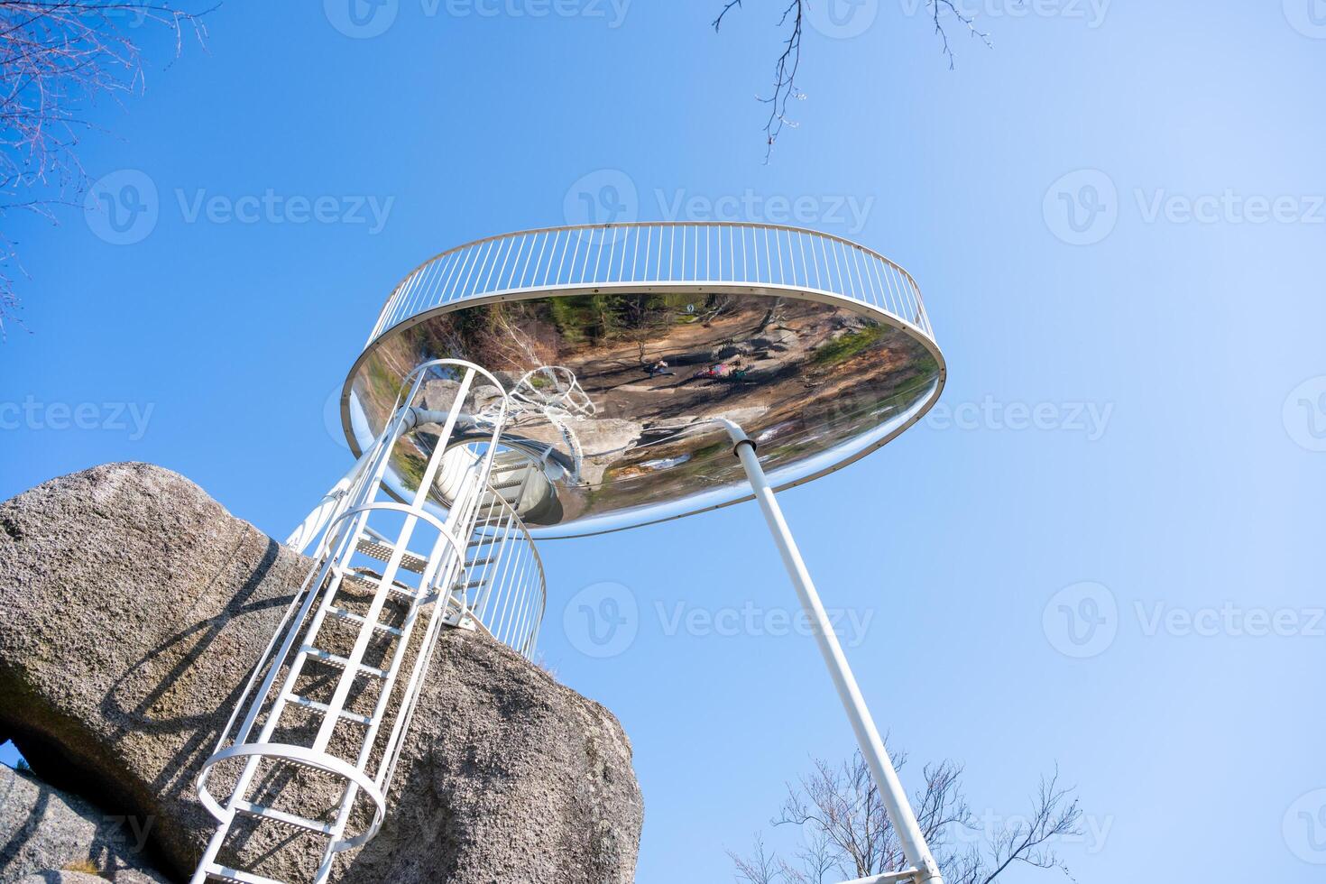 Located near Tanvald in the Jizera Mountains, Sipka lookout platform provides breathtaking panoramic views. Visitors can climb the stairs to enjoy the serene landscape on a clear day. photo