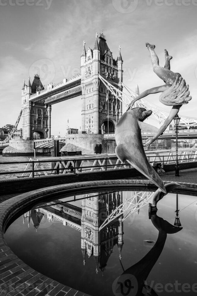 Sculpture with Tower Bridge reflection photo