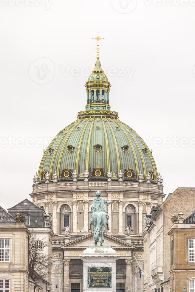 Frederik's Church, also known as the Marble Church, features an impressive dome and the equestrian statue of King Frederick V, set in Amalienborg Square in Copenhagen. photo
