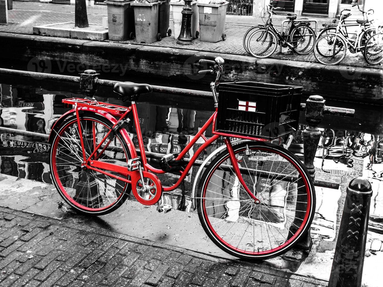 Red bicycle in Amsterdam , Netherlands photo