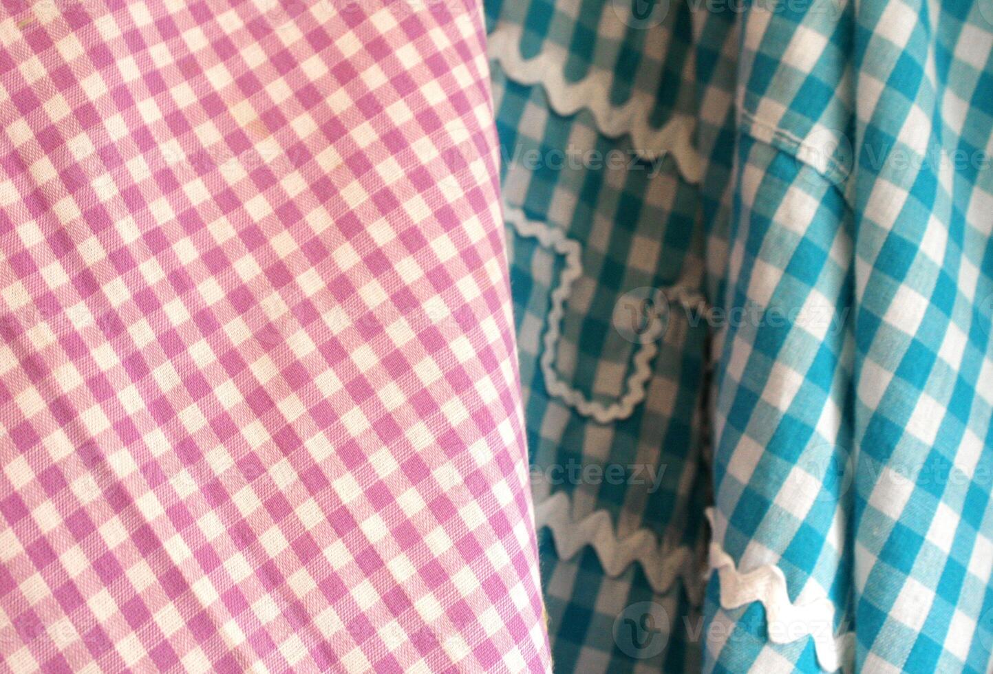 Close Up Detail of Pink and Turquoise Gingham Fabrics photo