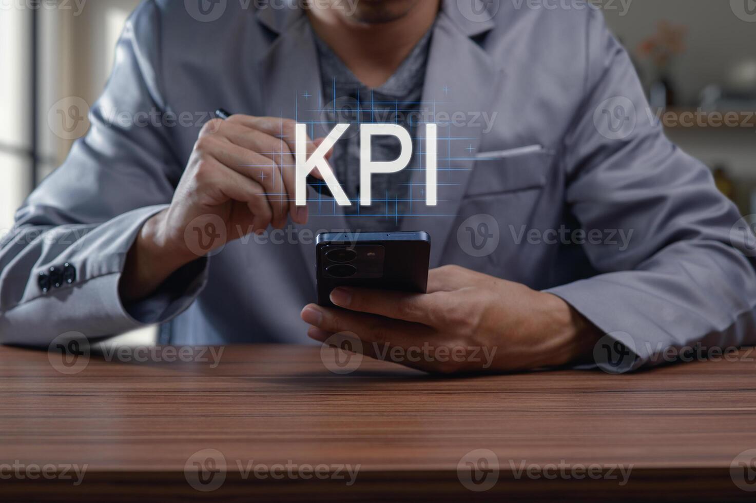 Business Professional Analyzing Key Performance Indicators on Phone photo
