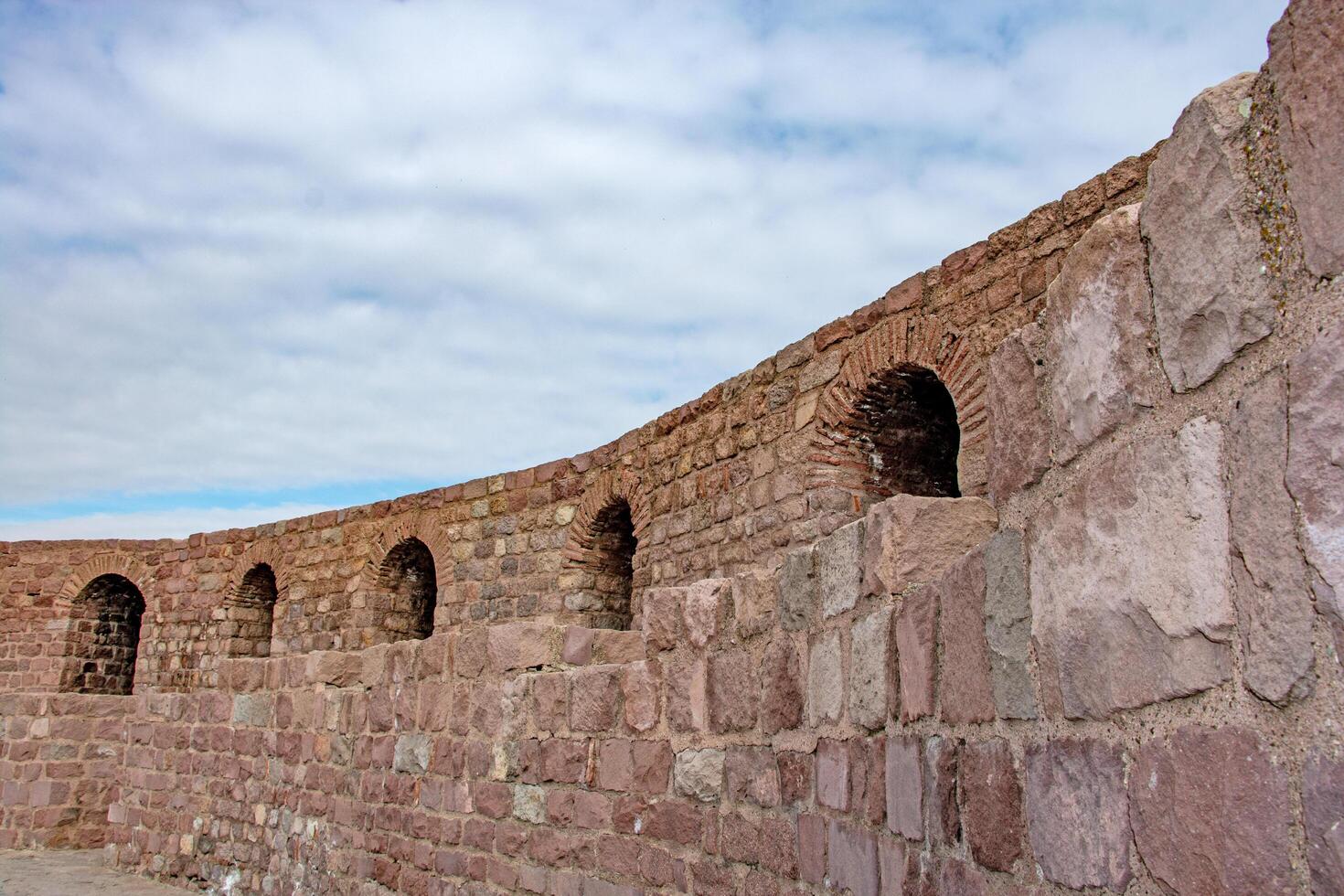 Ancient Stone Wall Architectural Detail of Historic Fortification photo