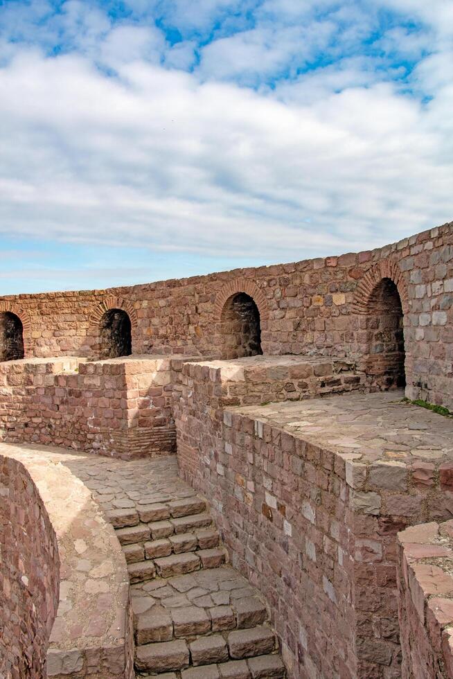 Ancient Stone Fortress Walls Architectural Detail and Pathway photo