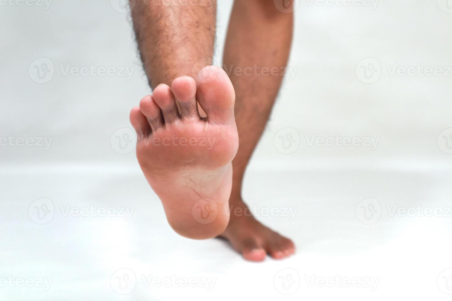 Close-up of the sole of a man's foot showcasing skin texture and foot anatomy, perfect for health and wellness visuals photo