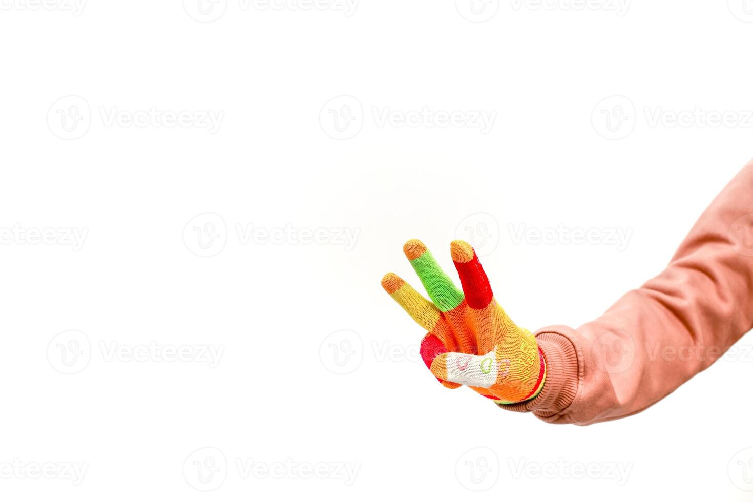 A colorful hand gesture with three fingers up against a plain white background showing positive attitude photo